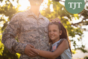 Military parent with daughter, representing a family affected by a New Jersey DCPP case