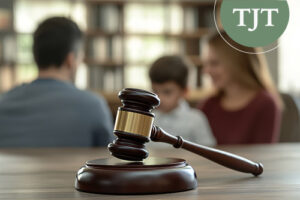 Judge's gavel in the foreground with parents and a child in the background, representing DCPP and criminal court proceedings in NJ